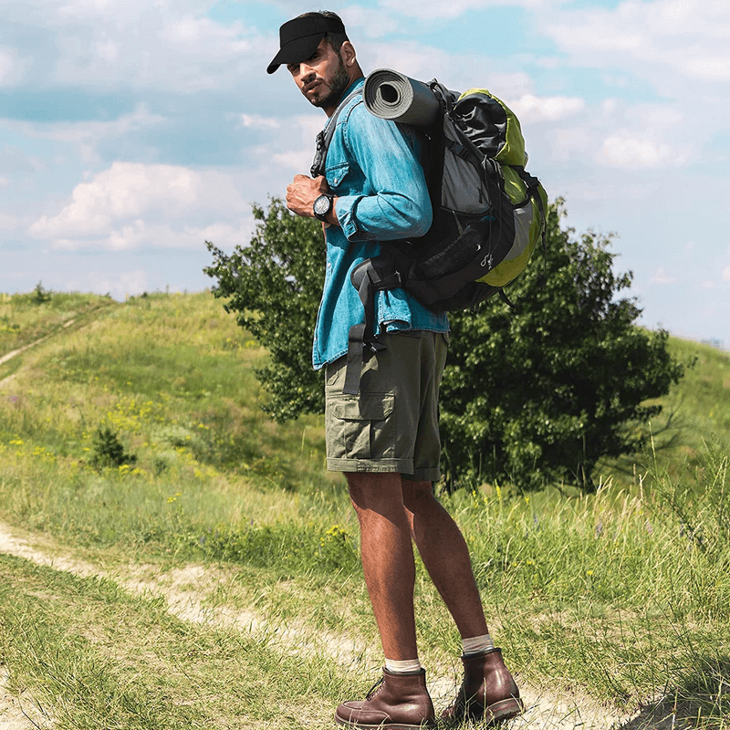 Man hiking with a backpack and camping gear on a sunny day